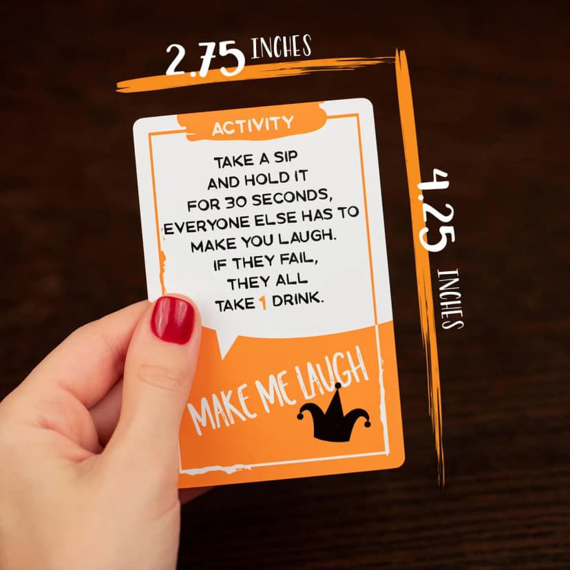 A player reads the Make Me Laugh card