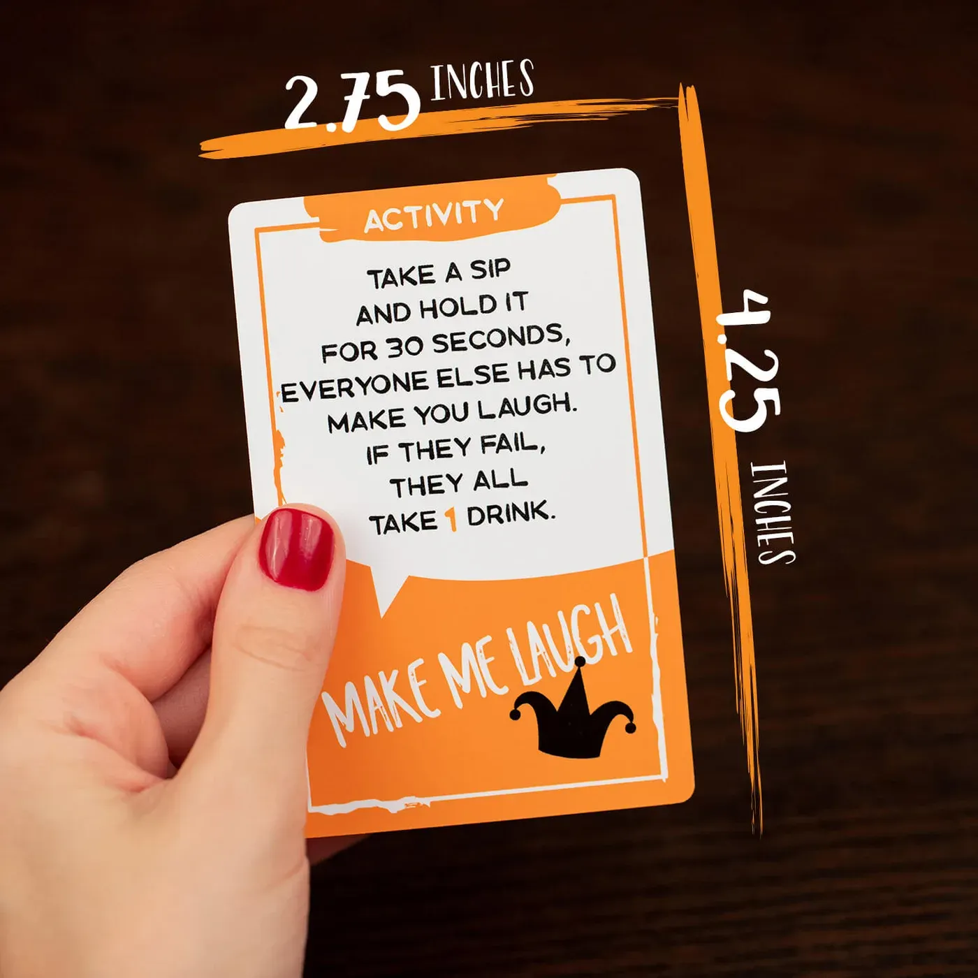 A player holds up a Sotally Tober activity card mid-game